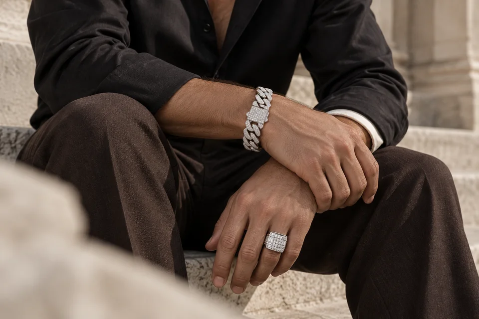 Silver Cuban bracelet and statement ring styled with dark tailoring